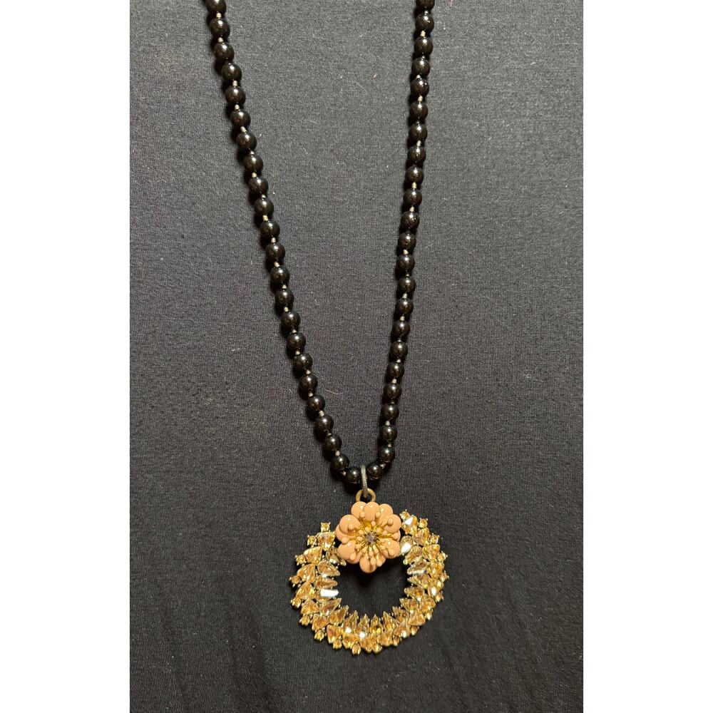 Y59  Gold Colored Circle on long black bead necklace